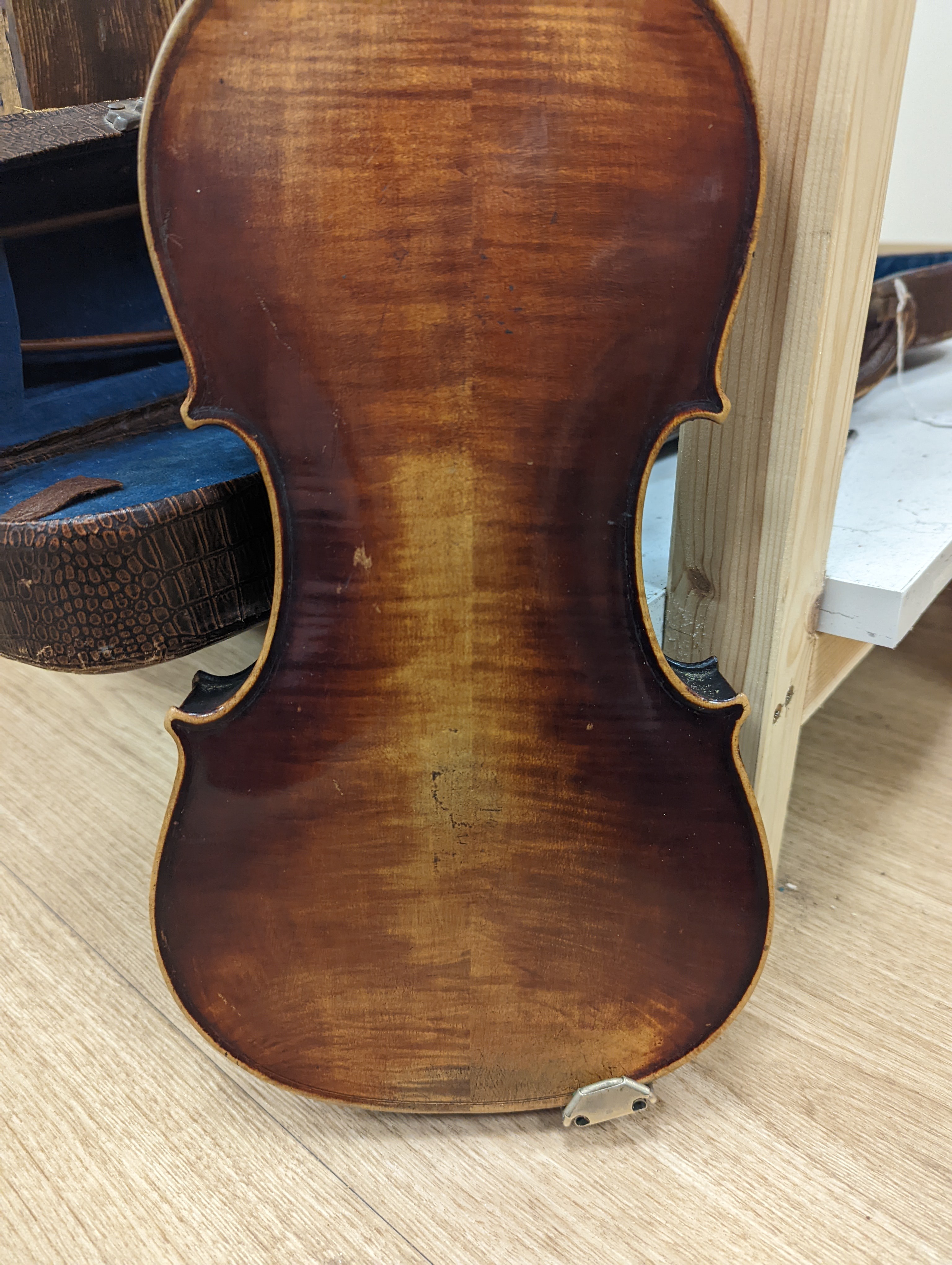 A late 19th century German violin and two bows, cased